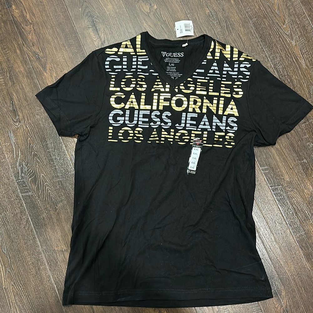 Guess men’s size large v-neck tee with tags never worn